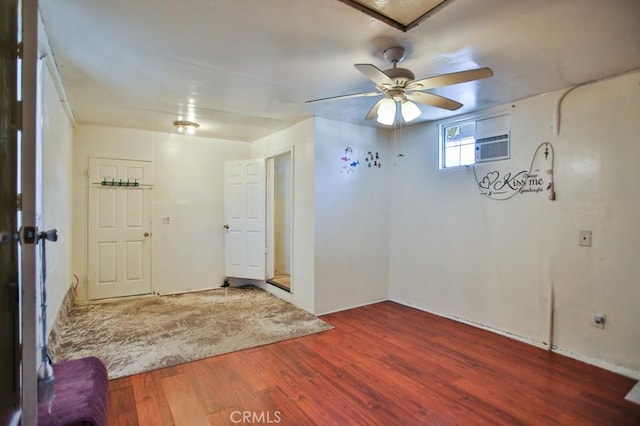 2851 Webster Ave, Long Beach, CA 90810 - spare room featuring wood finished floors, ceiling fan, and a wall mounted AC