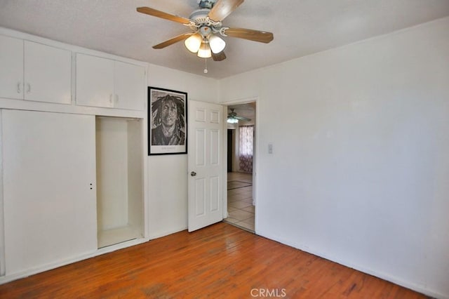 2851 Webster Ave, Long Beach, CA 90810 - unfurnished bedroom featuring a closet, wood finished floors, and baseboards