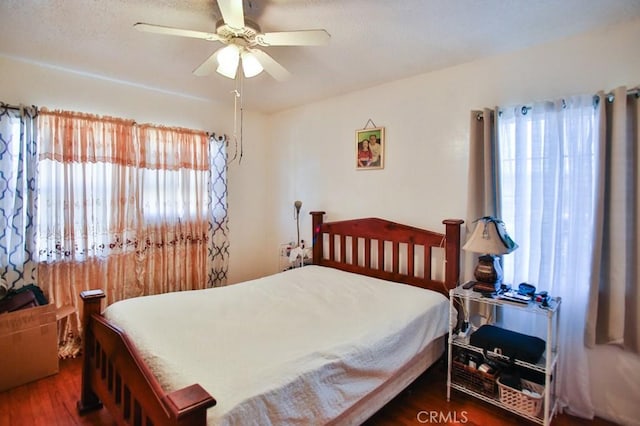 2851 Webster Ave, Long Beach, CA 90810 - bedroom featuring multiple windows, wood finished floors, and ceiling fan