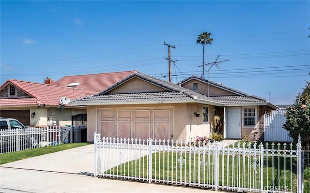 25176 Wendy Way, Moreno Valley, CA 92551 - view of front facade with concrete driveway, a garage, stucco siding, a tile roof, and a fenced front yard