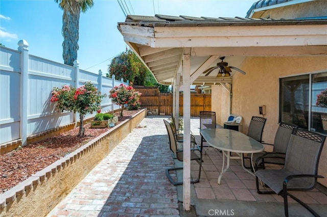 25176 Wendy Way, Moreno Valley, CA 92551 - fenced backyard with ceiling fan, outdoor dining area, and a patio