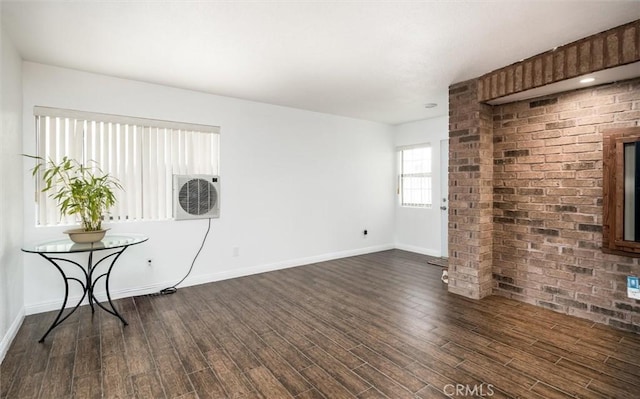25176 Wendy Way, Moreno Valley, CA 92551 - unfurnished living room with dark wood-style floors and baseboards