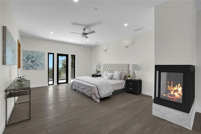 255 El Cielo Ln, Bradbury, CA 91008 - bedroom with wood finished floors, baseboards, a multi sided fireplace, recessed lighting, and access to outside