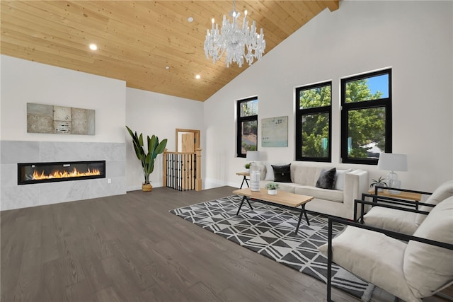 living area featuring high vaulted ceiling, wood ceiling, wood finished floors, recessed lighting, and a tiled fireplace