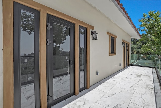 255 El Cielo Ln, Bradbury, CA 91008 - view of exterior entry with stucco siding and a balcony