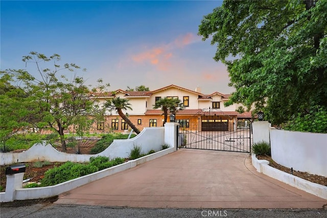 255 El Cielo Ln, Bradbury, CA 91008 - mediterranean / spanish home with driveway, a gate, an attached garage, and a tile roof