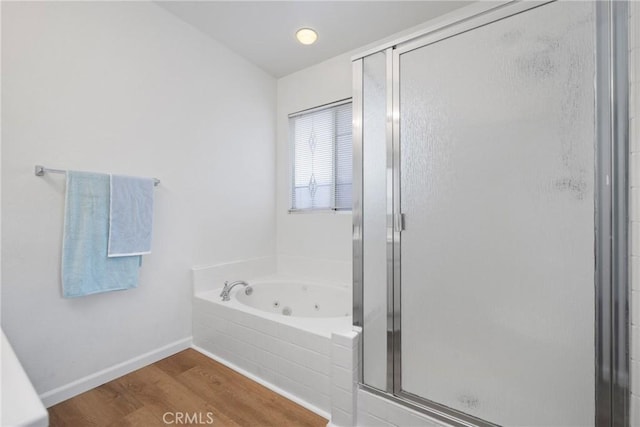 225 Caldera Ln, Hemet, CA 92545 - full bath featuring a stall shower, a whirlpool tub, wood finished floors, and baseboards