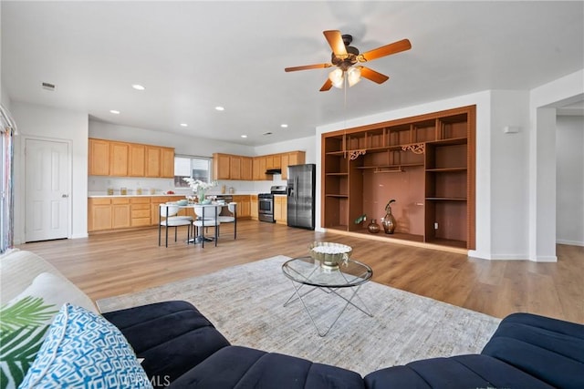 225 Caldera Ln, Hemet, CA 92545 - living room featuring a ceiling fan, light wood-style floors, recessed lighting, and baseboards