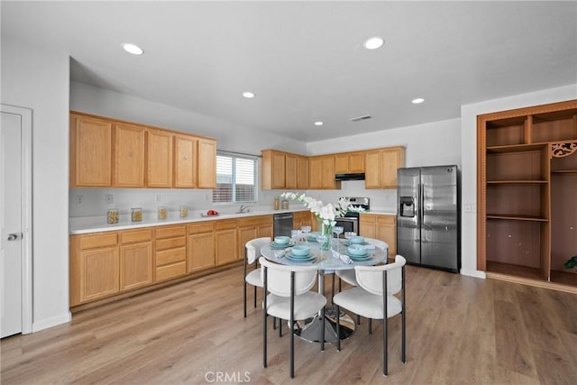 225 Caldera Ln, Hemet, CA 92545 - kitchen with appliances with stainless steel finishes, a sink, light countertops, recessed lighting, and light wood finished floors
