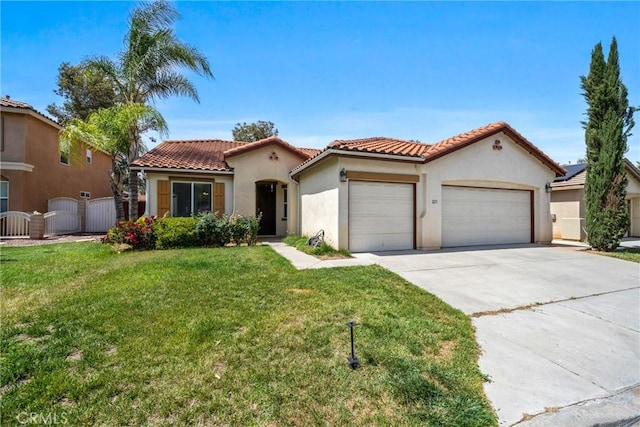 225 Caldera Ln, Hemet, CA 92545 - mediterranean / spanish-style home with an attached garage, stucco siding, driveway, a gate, and a tiled roof