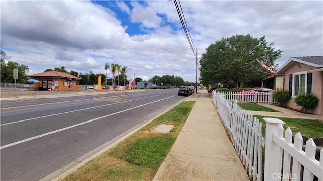 533 S Kaweah Ave, Exeter, CA 93221 - view of asphalt road featuring sidewalks and curbs