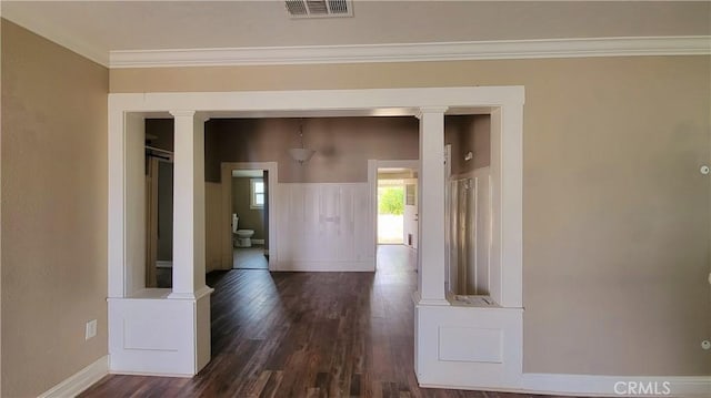 533 S Kaweah Ave, Exeter, CA 93221 - corridor with dark wood-type flooring, crown molding, baseboards, and ornate columns