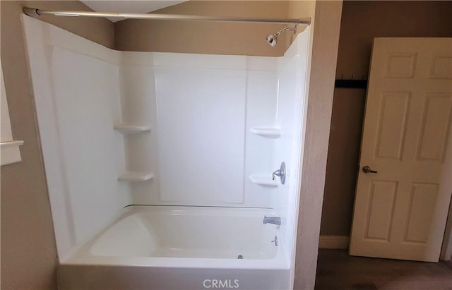 533 S Kaweah Ave, Exeter, CA 93221 - bathroom with shower / bathtub combination and wood finished floors