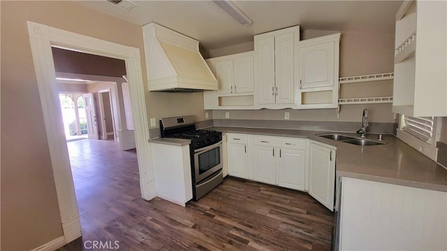 533 S Kaweah Ave, Exeter, CA 93221 - kitchen with stainless steel range with gas stovetop, custom range hood, a sink, white cabinets, and dark wood finished floors