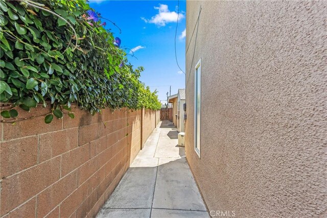 5471 Santa Gertrudes Ave, Garden Grove, CA 92845 - view of home's exterior featuring stucco siding, a fenced backyard, and a patio area