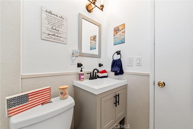 5471 Santa Gertrudes Ave, Garden Grove, CA 92845 - half bathroom with vanity, toilet, and wainscoting