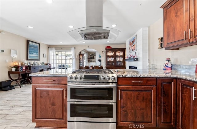 5471 Santa Gertrudes Ave, Garden Grove, CA 92845 - kitchen featuring double oven range, island exhaust hood, recessed lighting, arched walkways, and a peninsula
