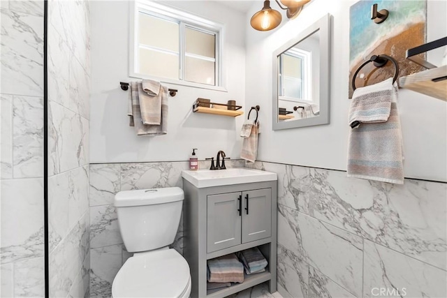 5471 Santa Gertrudes Ave, Garden Grove, CA 92845 - bathroom featuring tile walls, vanity, toilet, and a wainscoted wall
