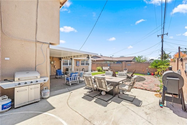 5471 Santa Gertrudes Ave, Garden Grove, CA 92845 - fenced backyard featuring a patio area, outdoor dining area, and area for grilling