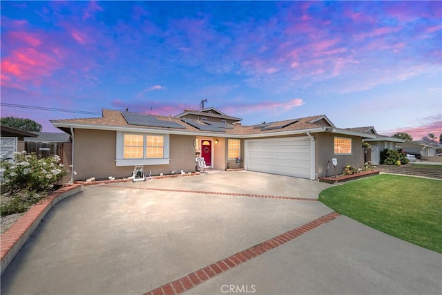 5471 Santa Gertrudes Ave, Garden Grove, CA 92845 - ranch-style home featuring stucco siding, concrete driveway, an attached garage, and roof mounted solar panels