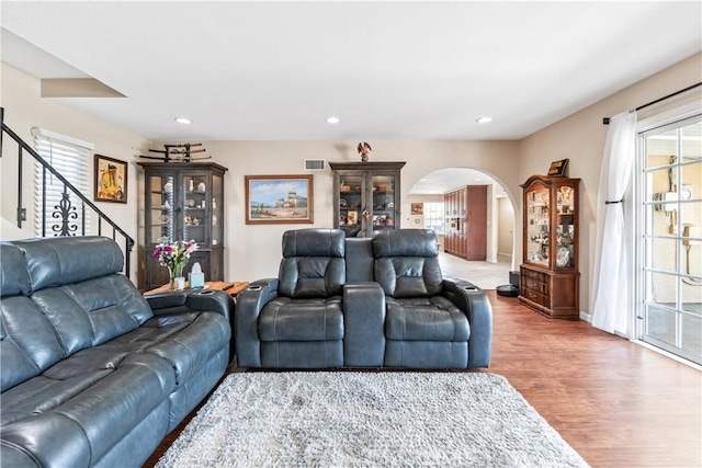5471 Santa Gertrudes Ave, Garden Grove, CA 92845 - living area featuring arched walkways, wood finished floors, recessed lighting, stairs, and baseboards