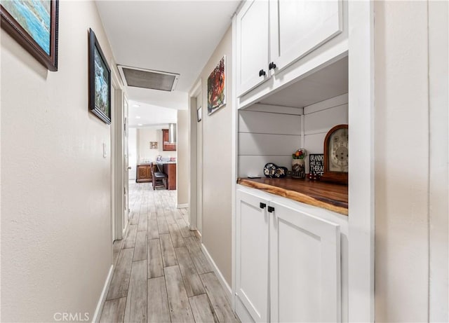 5471 Santa Gertrudes Ave, Garden Grove, CA 92845 - corridor with baseboards, light wood-style floors, and attic access