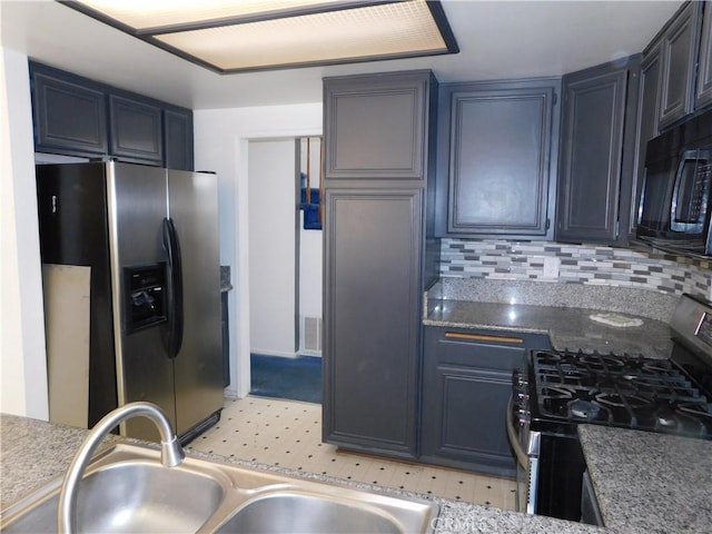 10755 Jasper Ave, Redlands, CA 92374 - kitchen with appliances with stainless steel finishes, a sink, and tasteful backsplash