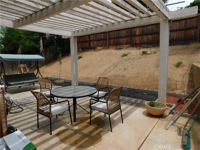 10755 Jasper Ave, Redlands, CA 92374 - view of patio with outdoor dining space, a fenced backyard, and a pergola