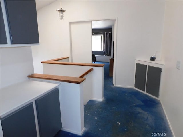 10755 Jasper Ave, Redlands, CA 92374 - hall with an upstairs landing, unfinished concrete flooring, and baseboards
