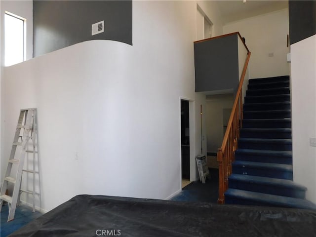 10755 Jasper Ave, Redlands, CA 92374 - staircase featuring a towering ceiling