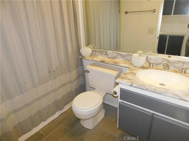 10755 Jasper Ave, Redlands, CA 92374 - full bath with toilet, wood finished floors, vanity, and a shower with shower curtain