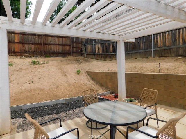 10755 Jasper Ave, Redlands, CA 92374 - view of patio featuring a pergola, a fenced backyard, and outdoor dining space