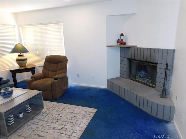 10755 Jasper Ave, Redlands, CA 92374 - living room featuring carpet, a brick fireplace, and baseboards