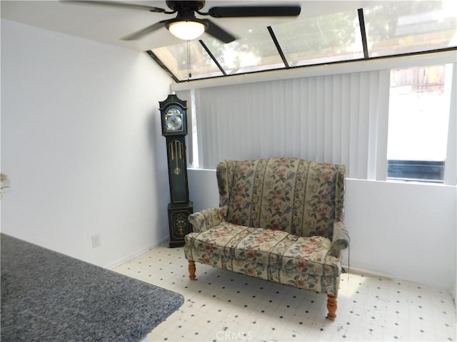 10755 Jasper Ave, Redlands, CA 92374 - sitting room with tile patterned floors, a ceiling fan, and baseboards