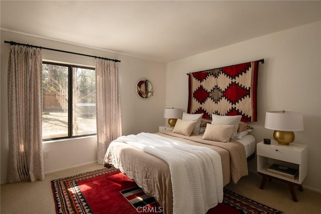 bedroom with carpet and baseboards