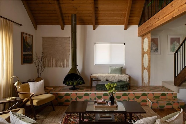 living room featuring wood ceiling, stairway, a wood stove, and wood finished floors
