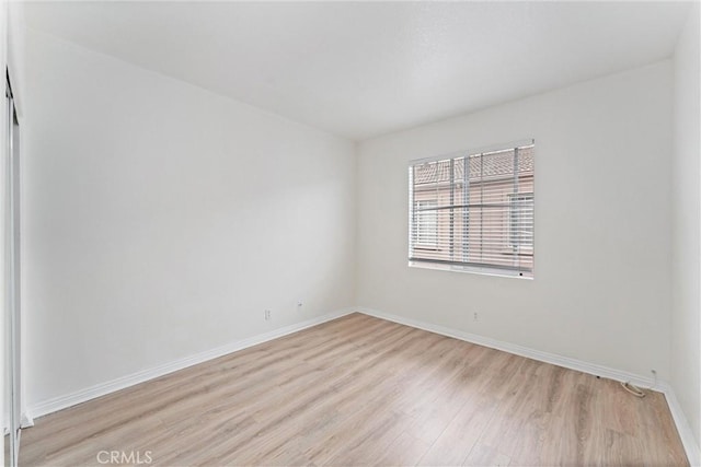 21848 S Vermont Ave Unit 6, Torrance, CA 90502 - spare room featuring light wood-style flooring and baseboards