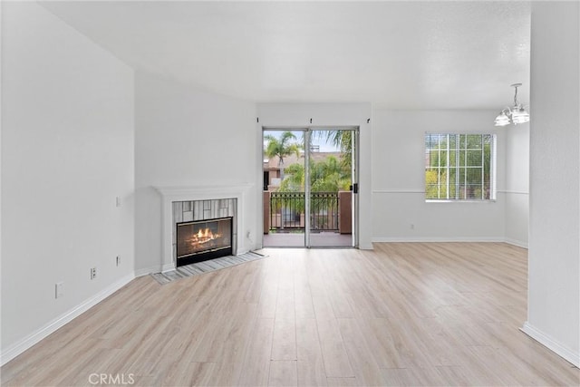 21848 S Vermont Ave Unit 6, Torrance, CA 90502 - unfurnished living room with plenty of natural light and light wood-type flooring