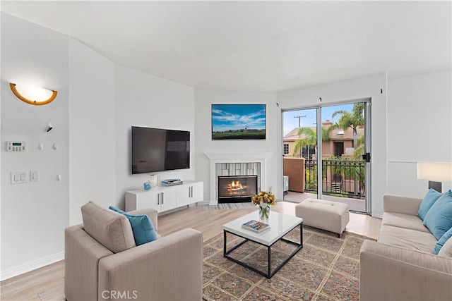 21848 S Vermont Ave Unit 6, Torrance, CA 90502 - living area featuring wood finished floors and a glass covered fireplace