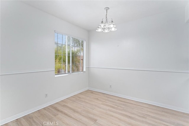 21848 S Vermont Ave Unit 6, Torrance, CA 90502 - unfurnished room featuring a chandelier and light wood-style flooring