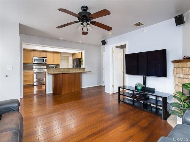 22305 Ladeene Ave, Torrance, CA 90505 - living room with a ceiling fan, dark wood-style floors, and baseboards