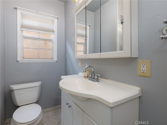 22305 Ladeene Ave, Torrance, CA 90505 - bathroom featuring marble finish flooring, toilet, vanity, and baseboards