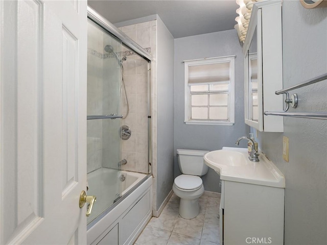 22305 Ladeene Ave, Torrance, CA 90505 - bathroom featuring toilet, vanity, bath / shower combo with glass door, and baseboards