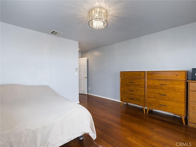 22305 Ladeene Ave, Torrance, CA 90505 - bedroom featuring a chandelier, wood finished floors, and baseboards