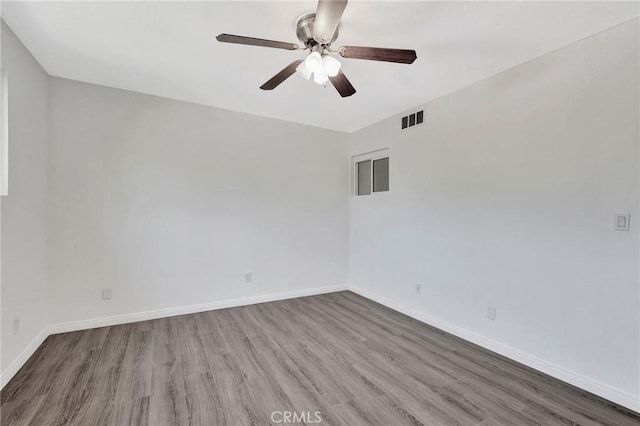 17053 Roscoe Blvd Unit 3, Northridge, CA 91325 - empty room featuring a ceiling fan, wood finished floors, and baseboards