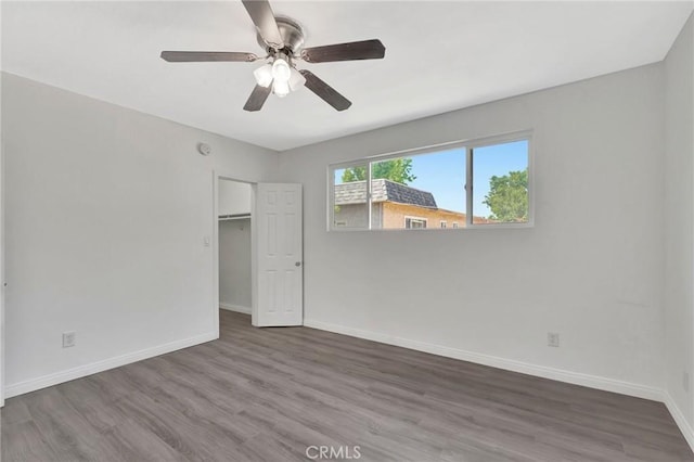 17053 Roscoe Blvd Unit 3, Northridge, CA 91325 - unfurnished bedroom with wood finished floors, baseboards, ceiling fan, and a closet