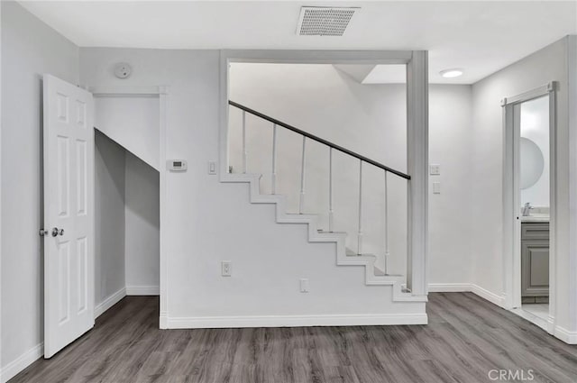 17053 Roscoe Blvd Unit 3, Northridge, CA 91325 - stairway with wood finished floors and baseboards