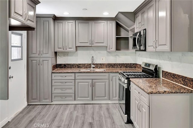 17053 Roscoe Blvd Unit 3, Northridge, CA 91325 - kitchen with stainless steel appliances, a sink, gray cabinets, dark stone countertops, and open shelves