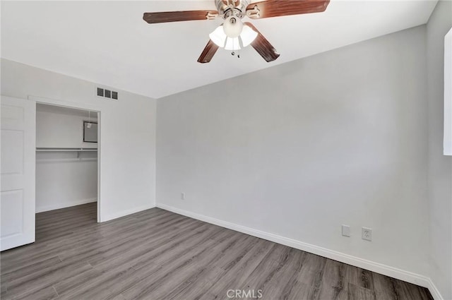 17053 Roscoe Blvd Unit 3, Northridge, CA 91325 - unfurnished bedroom featuring wood finished floors, a closet, baseboards, and ceiling fan