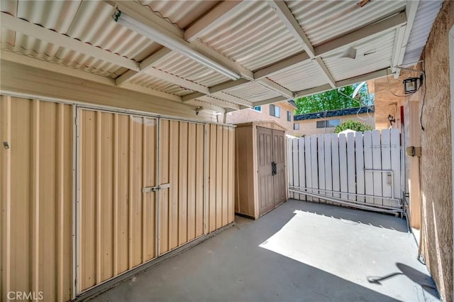 17053 Roscoe Blvd Unit 3, Northridge, CA 91325 - view of patio with a gate, a storage unit, and fence